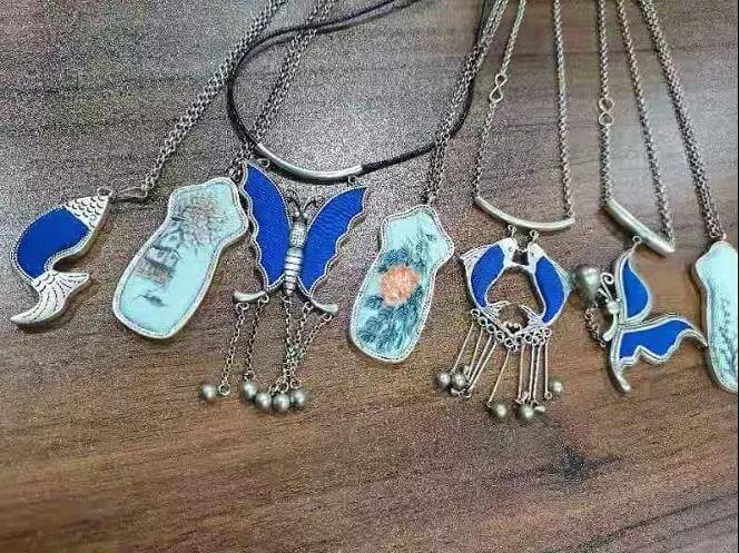 Kesi silver pendants and paintings